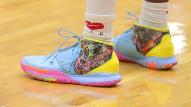 Bronny James wears Nike Kyrie shoes as he plays for Strive for Greatness in an AAU game.